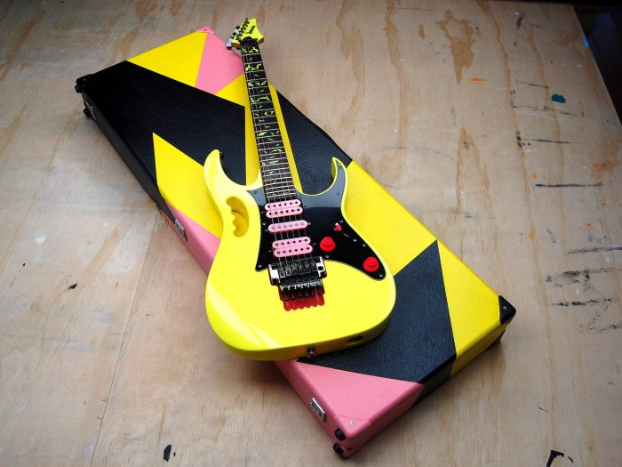 Electric guitar + guitar case, painted by Albert Compagner